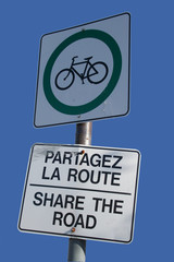 bilingual share the road sign