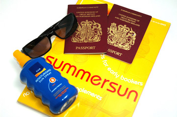 holiday brochure,sun cream,passports and sun glass