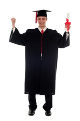 male graduate smiling holding a degree