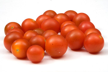 red tomatoes isolated against white