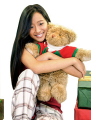 girl with teddy bear and presents