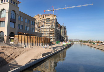 major office and condo development by river in sco