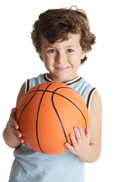 adorable boy playing the basketball