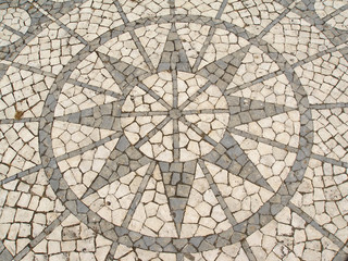 mosaic in a portuguese sidewalk