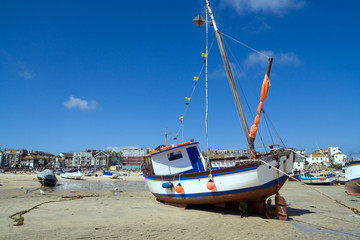 fishing boat at low tide - Powered by Adobe