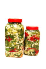 two jars with pickles isolated on white