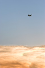 biplane over the clouds