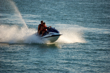Obraz premium woman and man on a jetski