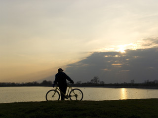 boy mountain bike lake reservoir sunset bicycle