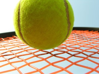 yellow ball on orange strings