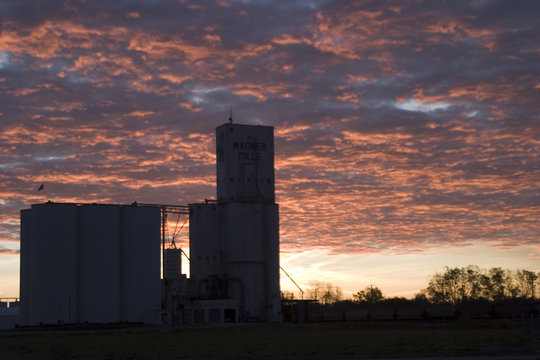 grain elevators against the morning sky