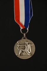 medal with archer and black background