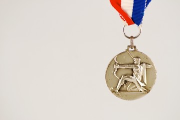 medal with archer and white background