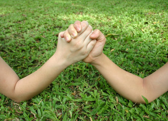 arm wrestle on the grass