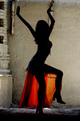 woman dancing belly-dance in oriental costume