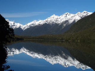 Naklejka na ściany i meble snow peak over mirror lake