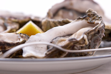 oysters, lemon and fork