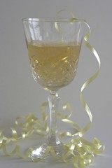 champagne glass with yellow ribbon