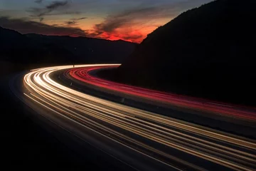 Foto op Plexiglas snelweg zonsondergang © Charles Aghoian