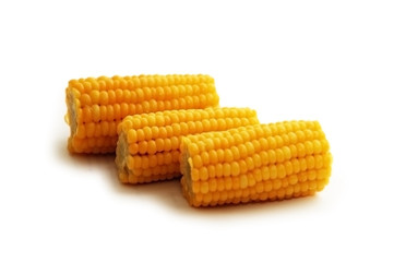 three corn cobs isolated on white background