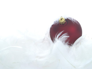 red ornaments in billowy feathers