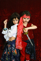 Fototapeta premium the boy and the girl in suits (pirate and gipsy).
