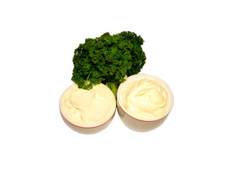 mayonnaise in sauce-boat with little bundle curly