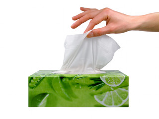 female hand taking a tissue from a box