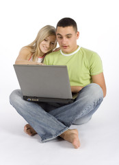 surprised young couple with laptop