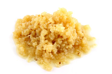 close up of chopped garlic on an isolated background