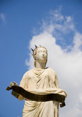 statue of a woman wearing a crown