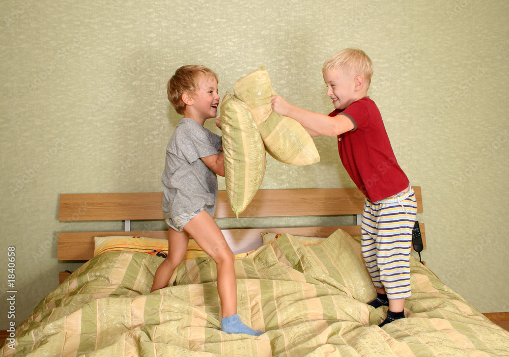 Wall mural children play with pillows