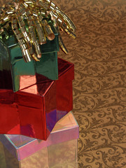 three gifts: stacked star boxes with curly ribbon