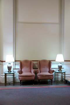 Two Easy Chairs In Lobby With High Ceiling