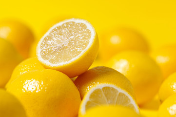 group of lemon on yellow background - obrazy, fototapety, plakaty
