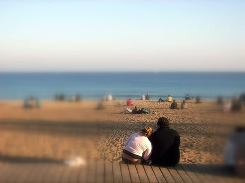 Fat Young Couple In Love On Beach Hugging