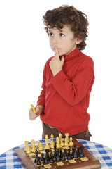 adorable boy playing the chess