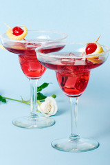 red cloud cocktail and white rose