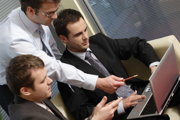 young business men working with latop in office