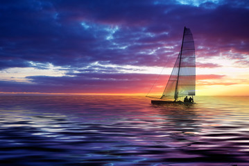 Fototapeta na wymiar żeglarstwo i zachód słońca