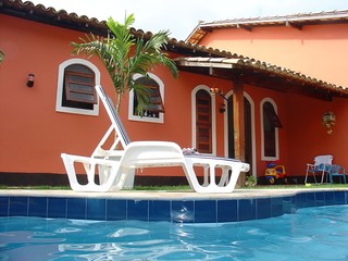 red house with swimming pool