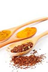 detail of spices in the spoons