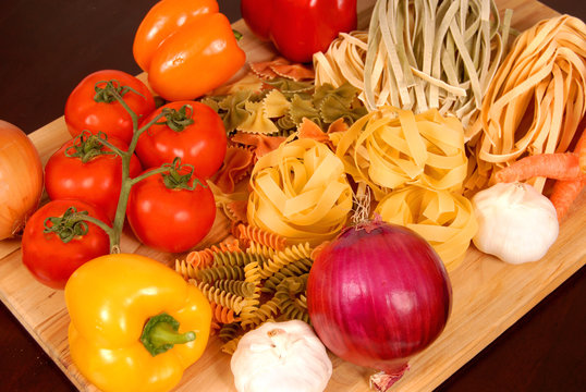 a bounty of italian foods resting on a cutting board