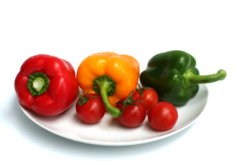 three peppers and some tomatoes