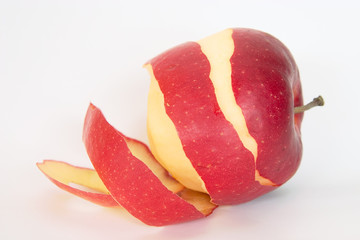 half peeled red apple