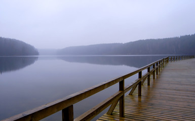 foggy lake and pier