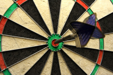 success shot! darts photo with arrow in bullseye