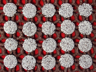  nonpareils and dark chocolate pretzels on red
