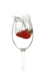 strawberry drop into glass