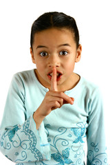 a young girl gesturing a request for silence